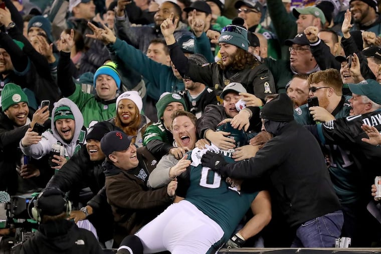 Eagles guard Stefen Wisniewski pulls off a Linc Leap into the crowd after Alshon Jeffery's fourth-quarter touchdown.
