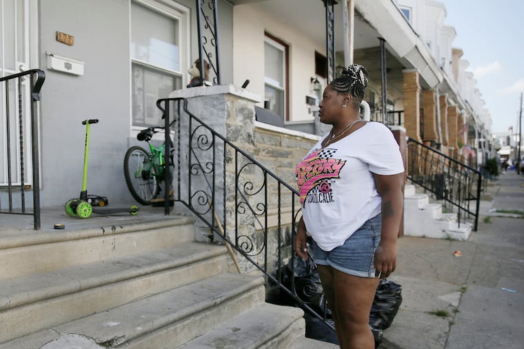 Makeeba McNeely in front of 222 N. Simpson St. in Phila. on Aug. 2, 2020. Just a day earlier, Zamar Jones, 7, was playing there on his porch when he was struck in the head by gunfire.