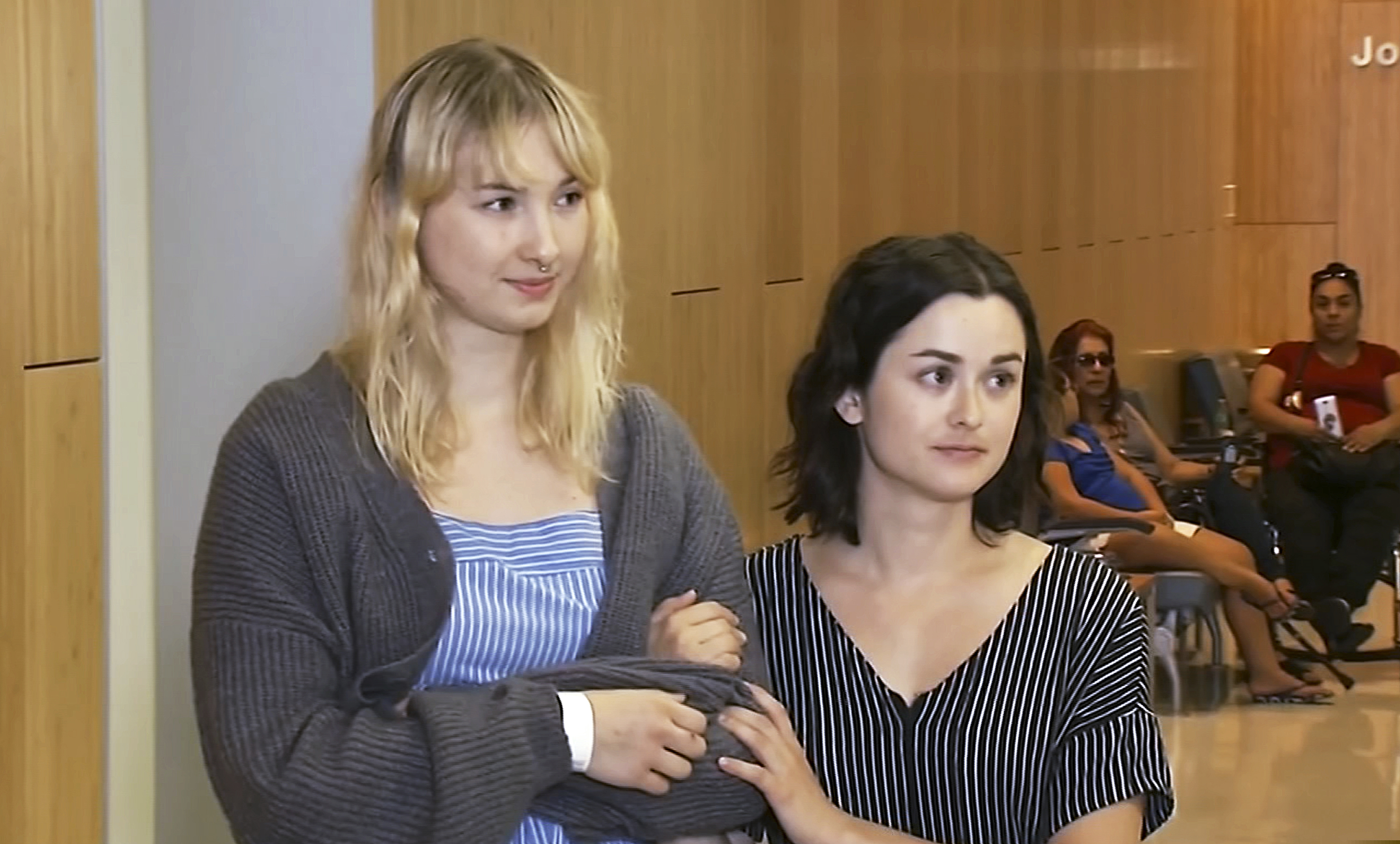 This photo taken from video provided by KGO-TV shows Brynn Ota-Mathews, 23, left, and Gabriella Gaus, 26, both wounded in the mass shooting at the Gilroy Garlic Festival, as they talk about their experience at Santa Clara Valley Regional Medical Center in Santa Clara, Calif., Thursday, Aug. 1, 2019.