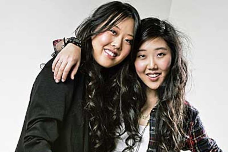 Forever 21's head of marketing Linda Chang, 28, left, and head of design Esther Chang, 23, pose for portrait at the company's Los Angeles, California headquarters. (Ricardo DeAratanha/Los Angeles Times/MCT)