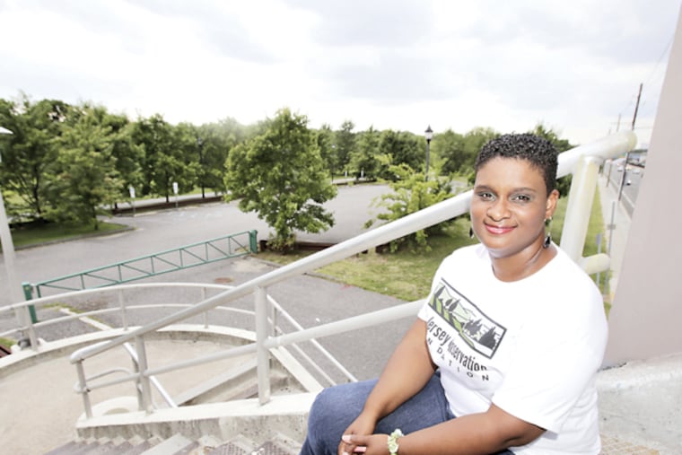 Olivia Glenn has a view of Gateway Park (left) from the steps of the pedestrian overpass that crosses Admiral Wilson Blvd in Camden on Aug. 20, 2014. (ELIZABETH ROBERTSON/Staff Photographer)