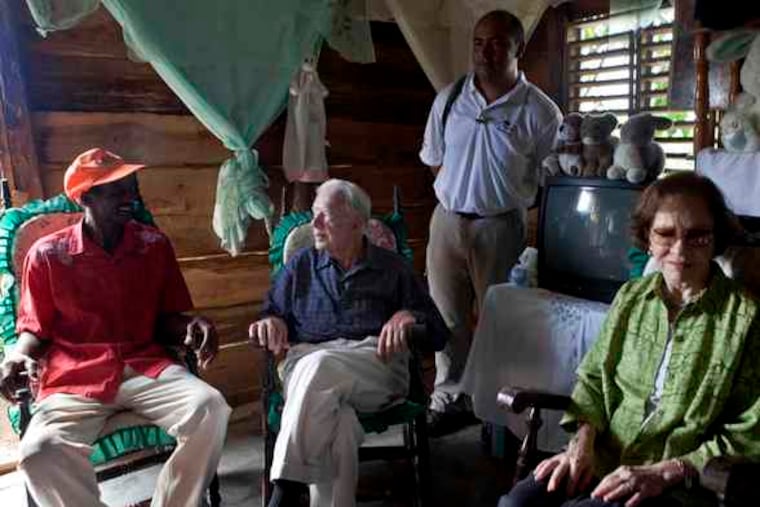 Former President Jimmy Carter and his wife, Rosalynn, with Juan Taveres in Dajabon, Dominican Republic. He's logged millions of miles mediating conflicts and advocating for human rights.
