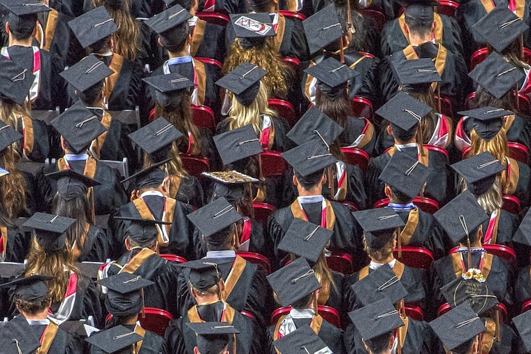 Graduates gather during Temple University graduation ceremony.