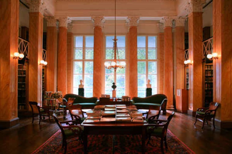 The library's main reading room. Painted pine Corinthian columns flank two tiered alcoves filled with general-interest books behind leaded glass doors. Subscribers' tastes dictate the collection: Mystery, biography, history abound; vampires, sci-fi, and horror are harder to come by. The library has 100,000 books.