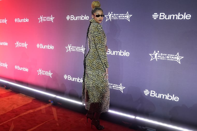 Chicago's Angel Reese shows off her cheetah print coat on the orange carpet for WNBA All-Star weekend.