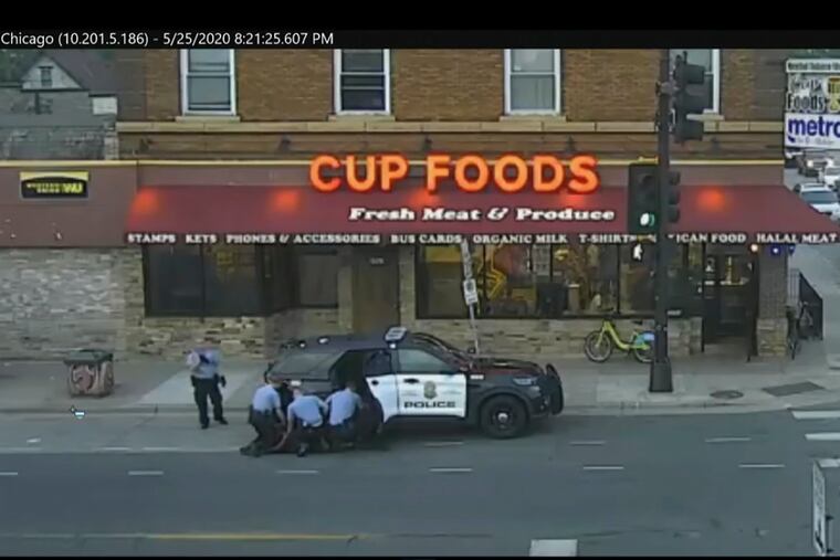 In this image from surveillance video, then-Minneapolis police officers from left, Tou Thao, Derek Chauvin, J. Kueng and Thomas Lane are seen attempting to take George Floyd into custody in Minneapolis on May 25, 2020.