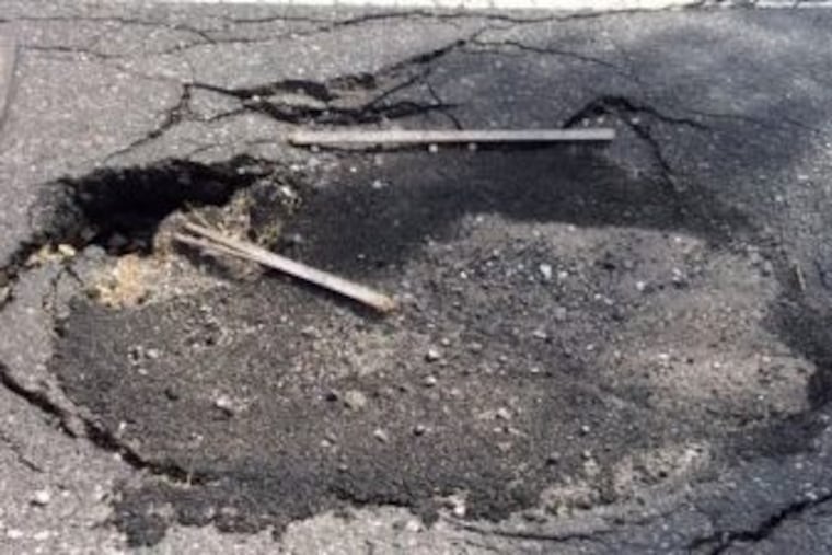 This sinkhole on Pattison Avenue near Citizens Bank Park caused Anthony Degliomini to crash his bike during charity bike ride May 17, 2015. A Philadelphia jury on Monday, March 5, 2018, awarded him $3.2 million in lawsuit against the city.
