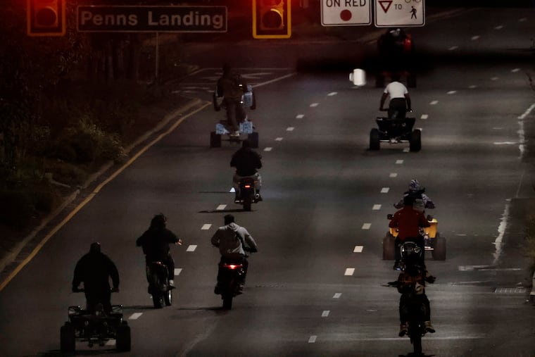 Dirt bikes, ATV’s and quads head north on Columbus Blvd., past Penns Landing, in Philadelphia in September.