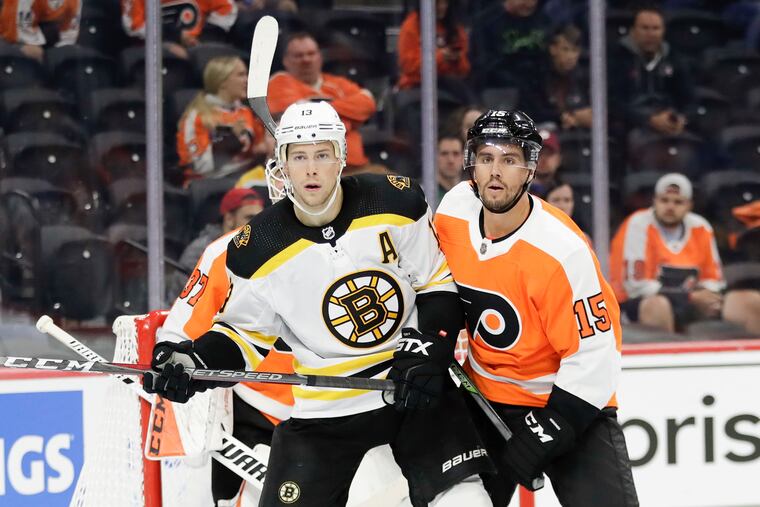 Flyers defenseman Matt Niskanen defending Bruins center Charlie Coyle in a recent preseason game.