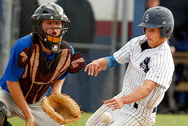 St. Augustine's Ryan Piscitelli scores past Pennsville catcher Chase Flickenger. (Ron Cortes/Staff Photographer)
