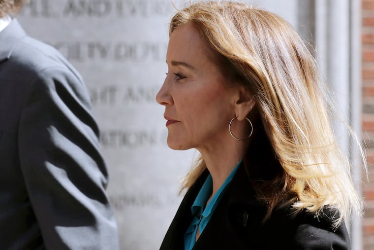 Actress Felicity Huffman arrives at federal court in Boston on Wednesday, April 3, 2019, to face charges in a nationwide college admissions bribery scandal.