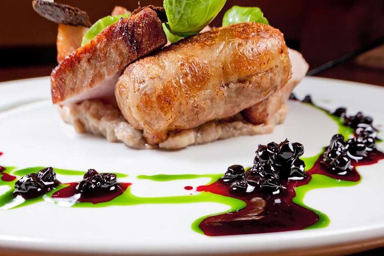 Berkshire pork, crushed chestnut, huckleberry-kale vinaigrette and pumpernickel as served at Laurel. ( DAVID M WARREN / Staff Photographer )