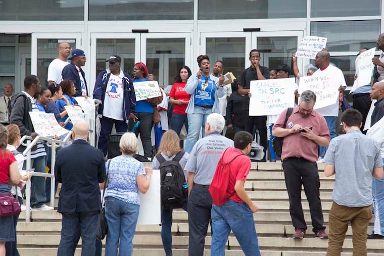Philadelphia public school parents and local advocacy groups protest Oct. 15, 2014, on the front steps of the school district building.