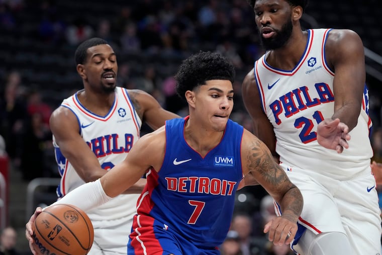 Pistons guard Killian Hayes drives on 76ers center Joel Embiid during the first half on Dec. 13 in Detroit.