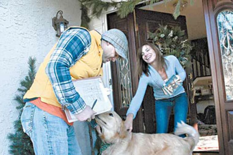 In Haddon Township, N.J., John Friers goes door to door asking folks about whether their dogs are properly licensed. Here, he visits the home of Nina Swallow. ( April Saul / Staff Photographer )