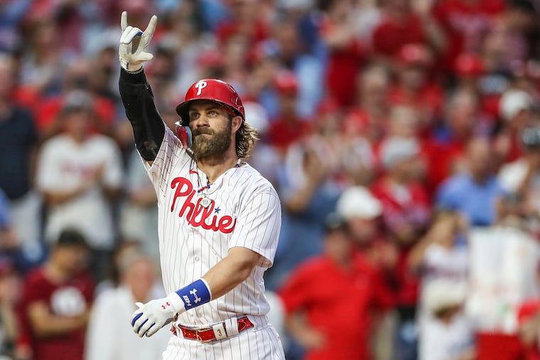 Philadelphia Phillies designated hitter Bryce Harper gestures after hitting a homerun in the second inning of a game against the Los Angeles Angels at Citizens Bank Park in Philadelphia on Tuesday, Aug. 29, 2023.