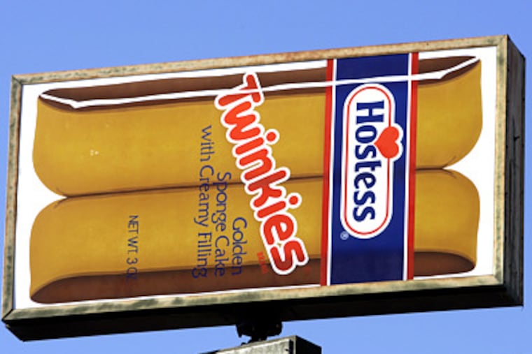 FILE - A Hostess Twinkies sign is shown at the Utah Hostess plant in Ogden, Utah, in this Nov. 15, 2012 file photo. Hostess, the maker of Twinkies, Ding Dongs and Wonder Bread, announced Friday Nov. 16, 2012 it is winding down operations and has filed a motion with the U.S. Bankruptcy Court seeking permission to close its business and sell its assets, including its iconic brands and facilities. (AP Photo/Rick Bowmer)