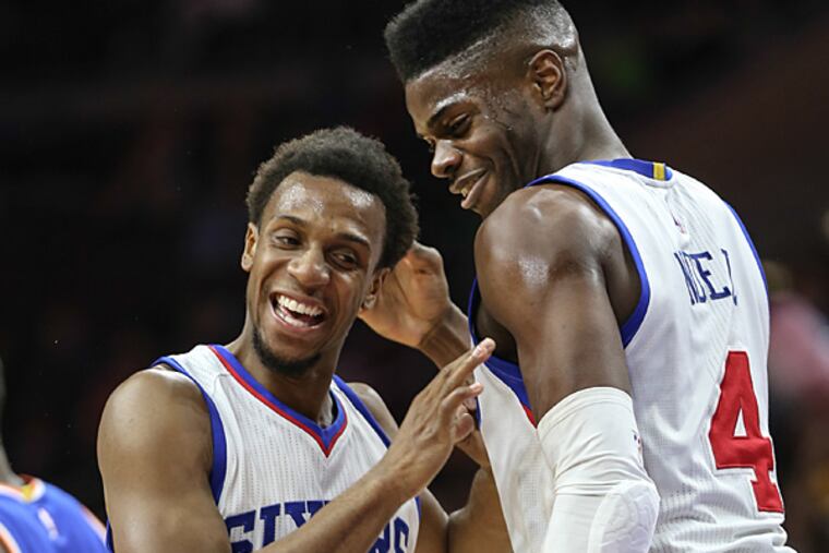Nerlens Noel (right) and Ish Smith. (Steven M. Falk/Staff Photographer)