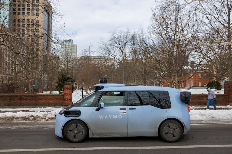 A Waymo vehicle traveling South Fourth Street in Philadelphia's Old City, in February. The autonomous vehicles are being tested in the city with backup human drivers on board.
