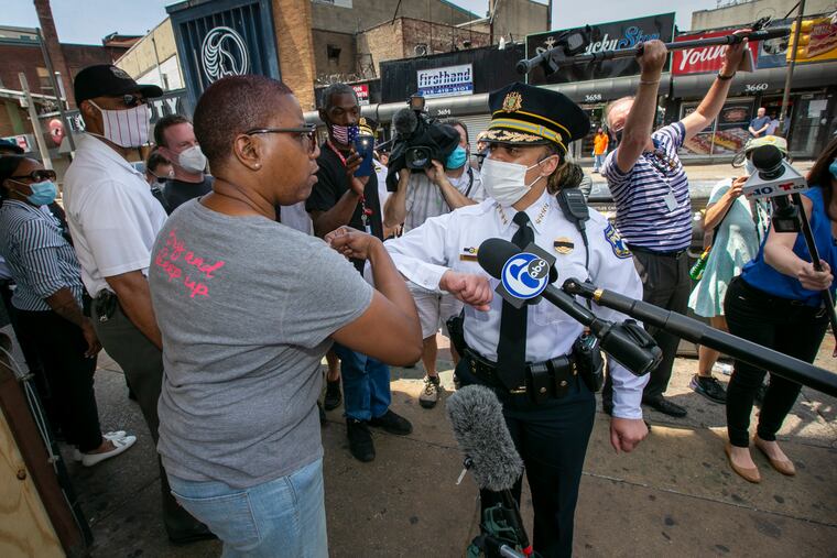 Police Commissioner Danielle Outlaw is shown support for her position by a community member Renae shouting, "We Love You." Outlaw and Mayor Jim Kenney visited the business district at Germantown, Erie, and N. Broad on Thursday, June 4, 2020. This was the scene of looting on the previous Sunday.