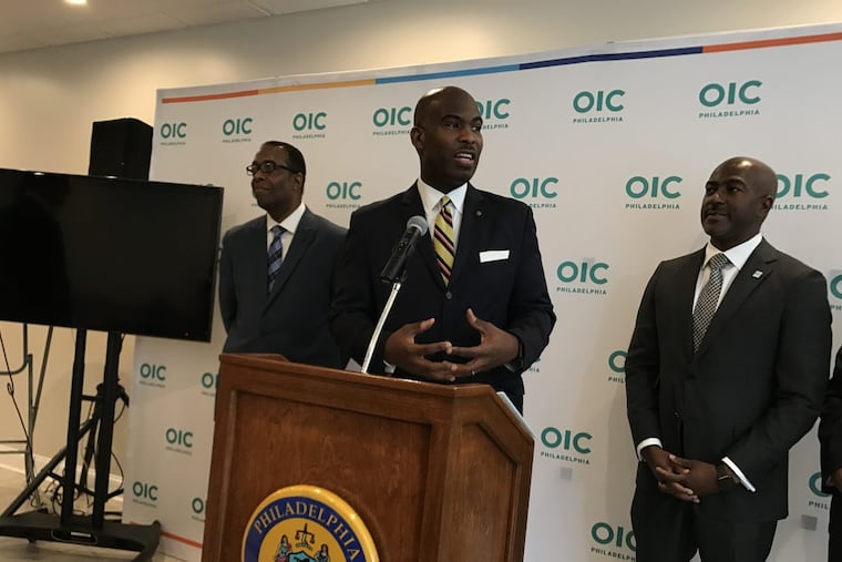 Philadelphia Councilman Derek Green, center, is sponsoring public campaign financing legislation.