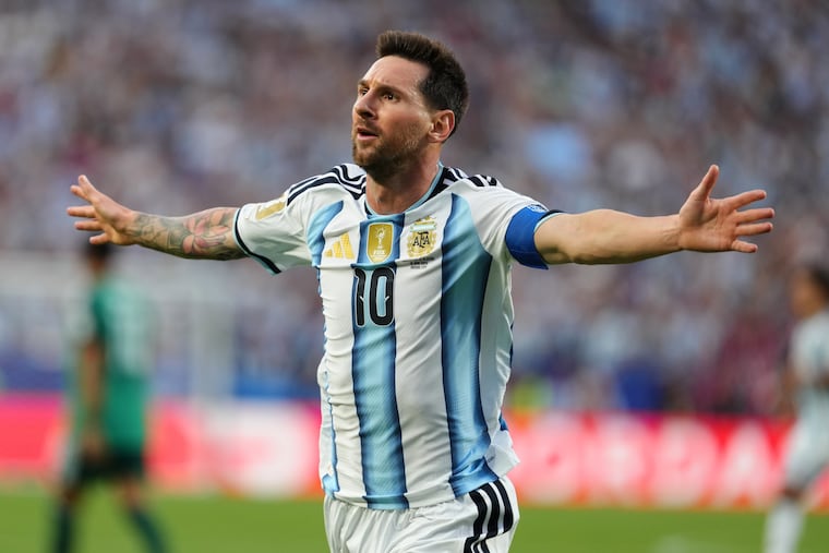 Argentina's Lionel Messi (10) celebrates after scoring the opening goal against Algeria in the World Cup.