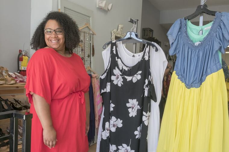 Friday May 19, 2017 Curve Conscious, a plus-size consignment shop on Girard Avenue is one of a few stores of its kind that gives plus-size women the opportunity to buy and sell clothing at a fraction of the price. Here, owner Adrienne Ray with dresses on display in the front of her shop., ED HILLE / Staff Photographer