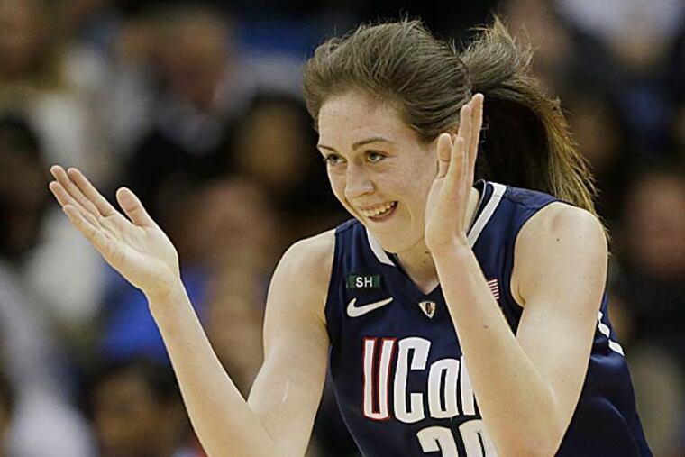 Connecticut forward Breanna Stewart reacts after making a three-point basket against Notre Dame during the first half. (Dave Martin/AP)