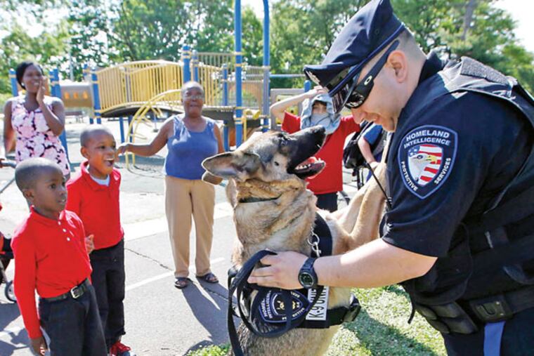 Chris Rodriguez’s dog, Misha, is always on the lookout for crime and a cheek to plant some kisses on. (YONG KIM / STAFF PHOTOGRAPHER)