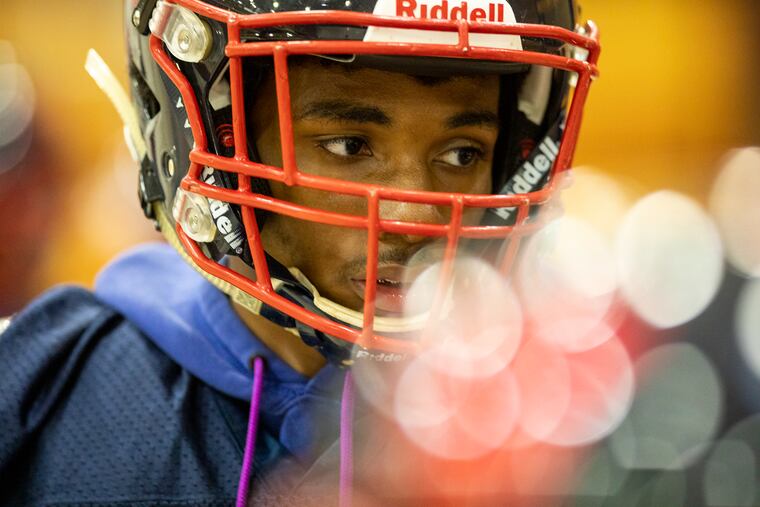 Senior receiver and defensive back player Chris Long leads Willingboro players in practice drills.