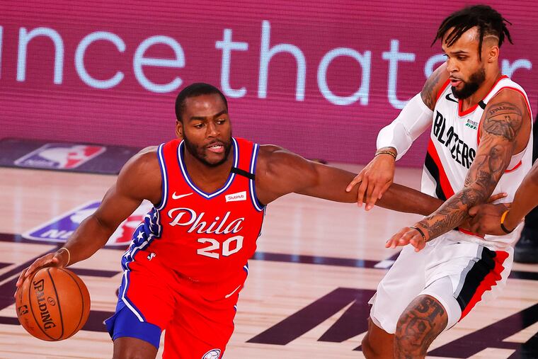 Philadelphia 76ers' Alec Burks moves the ball against Portland Trail Blazers' Gary Trent Jr. on Sunday.