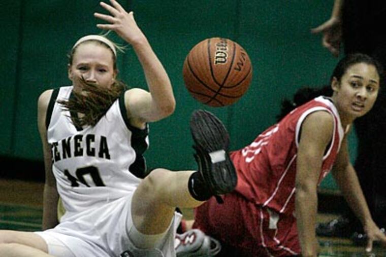 Seneca's Johanna Metzger (left) and Rancocas Valley's Lauren Gaskill fight for a loose ball. (Elizabeth Robertson/Staff Photographer)