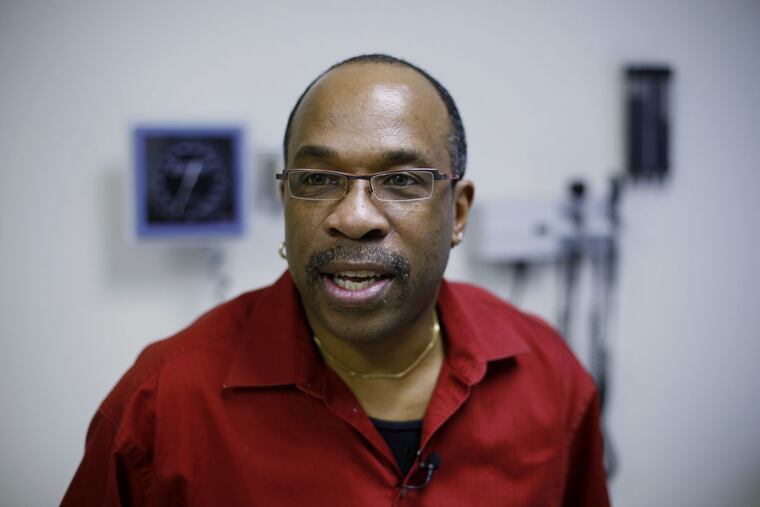 FILE – In this Feb. 25, 2011 file photo, Jay Johnson speaks during an interview at the University of Pennsylvania. Johnson, who works for Action AIDS, an advocacy and service organization in Philadelphia, had gene therapy treatment for HIV in 2011. Although the virus rebounded when he temporarily went off HIV medicines, tests show his modified blood cells are still multiplying.