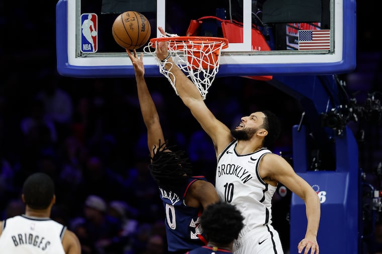 Sixers guard Tyrese Maxey shoots over former teammate Ben Simmons in Saturday's game. Maxey led the Sixers with 23 points, while Simmons did not attempt a shot in the Nets' win.