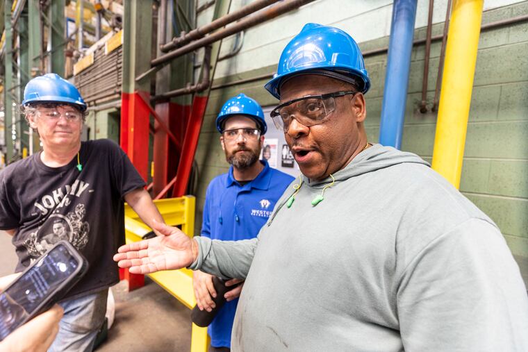 Ron Oxendine, Marlton, N.J., Press Operator, foreground, and colleagues at Western Extrusions in Pennsauken.