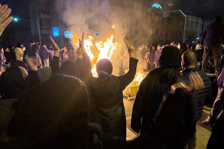 Iranians attend an anti-government protest in Tehran, Iran, on Friday.