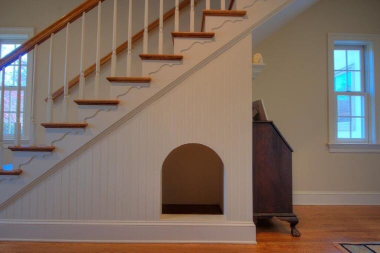 This Malvern home, on the market for $1,375,000, includes a built-in doghouse under the stairs.
