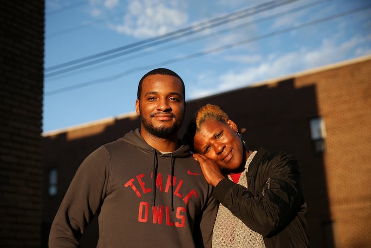 Hazim Hardeman, left, and his mother, Gwendolyn, stand for a portrait outside their West Philadelphia apartment on Tuesday, Sept. 18, 2018. Hazim Hardeman is Temple University's first Rhodes Scholar. TIM TAI / Staff Photographer