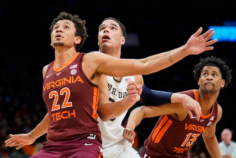 Keve Aluma (22) playing for Virginia Tech against Notre Dame in March 2022.