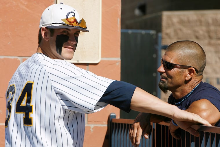 Bryce Harper with his dad, Ron, at a junior-college game in 2010.