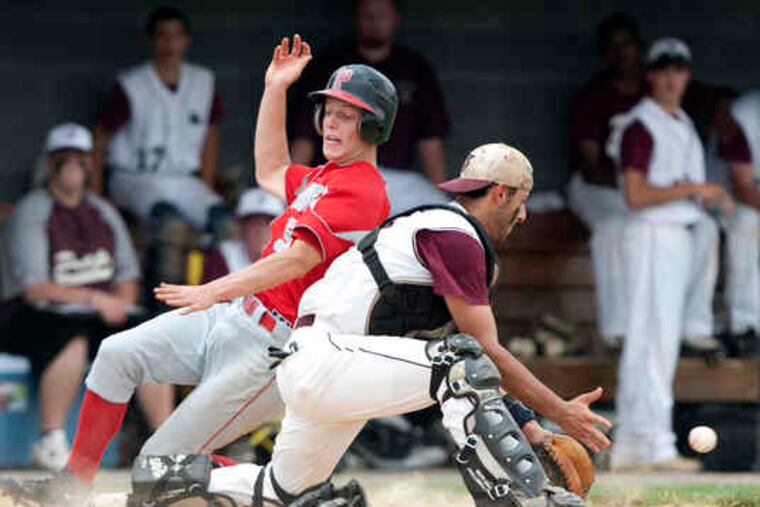 Parkland's Joe Abeln slides home to score past St. Joseph's Prep catcher Ray Toto in the first. Toto later homered.