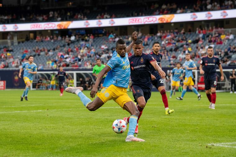 Cory Burke, center, scored one of the Union's goals against the Fire.