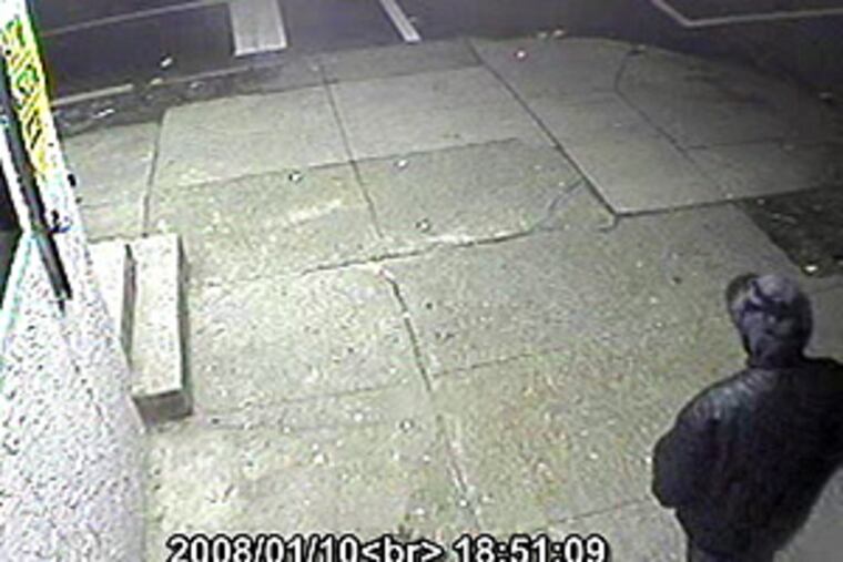 An image from a surveillance video camera outside the Variety Store at 57th and Arch Streets in West Philadelphia. Police say they are looking for the man in this tape, who is accused of fatally shooting someone at this scene Jan. 10.