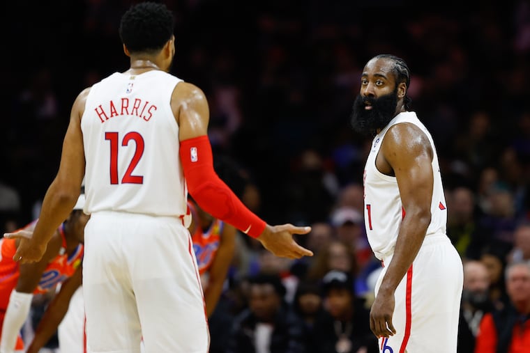 Sixers guard James Harden looks at teammate forward Tobias Harris during a game against the Oklahoma City Thunder on January 12, 2023, in Philadelphia.