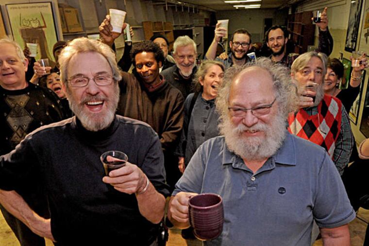 Larry Robin (right) and general manager Paul Hogan with staff and guests at Saturday's party. APRIL SAUL / Staff Photographer