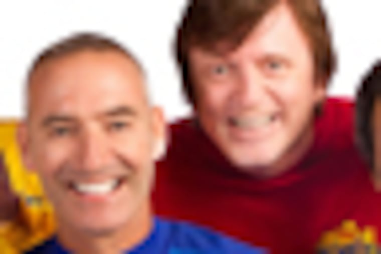 DM1WIG14z-a Yellow Wiggle Greg Page, Purple Wiggle Jeff Fatt, Red Wiggle Murray Cook, and Blue Wiggle Anthony Field
Credit: "Wiggles! Live USA"