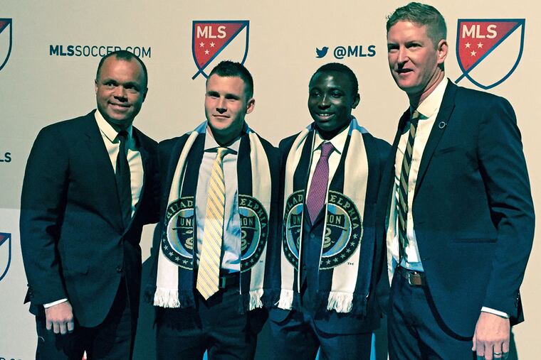From left, Union sporting director Earnie Stewart, No. 3 pick Keegan Rosenberry, No. 2 pick Joshua Yaro and coach Jim Curtin.