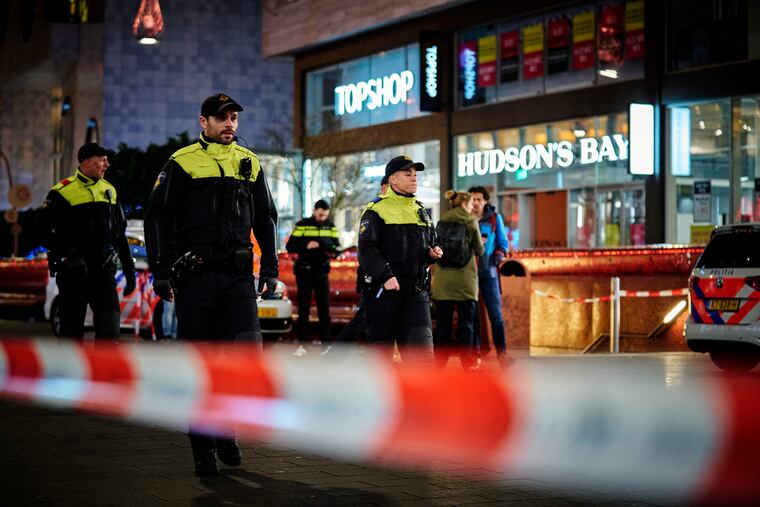 Dutch police secure a shopping street after a stabbing incident in the center of The Hague, Netherlands, Friday, Nov. 29, 2019. Dutch police say multiple people have been injured in a stabbing incident in The Hague's main shopping street.