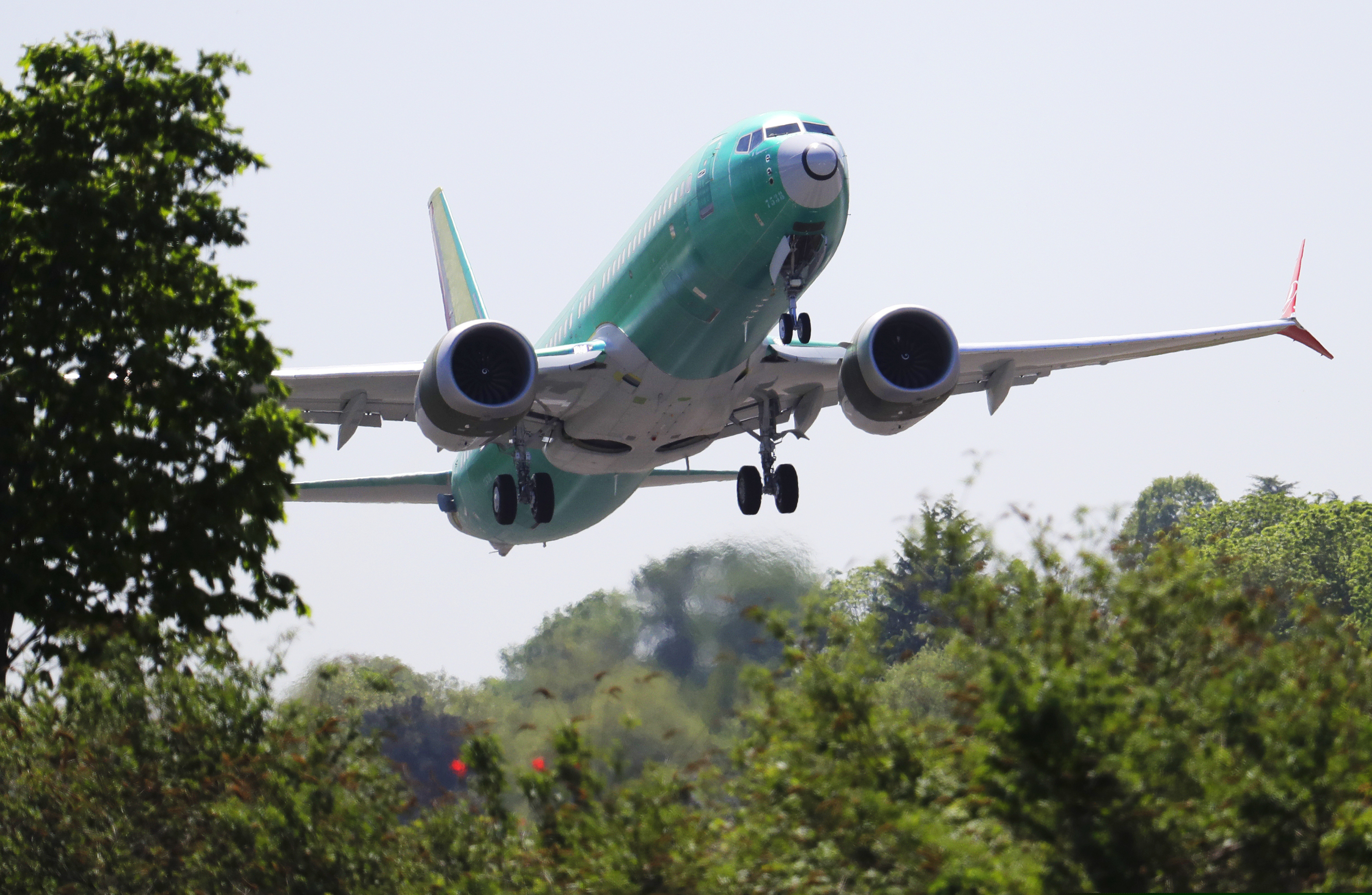 FILe - In this May 8, 2019, file photo, a Boeing 737 MAX 8 jetliner being built for Turkish Airlines takes off on a test flight in Renton, Wash. Representatives from more 30 countries met with Federal Aviation Administration officials Thursday, May 23, to hear the U.S. regulator's approach to determining how soon the Boeing 737 Max can resume flying after two crashes that killed 346 people.