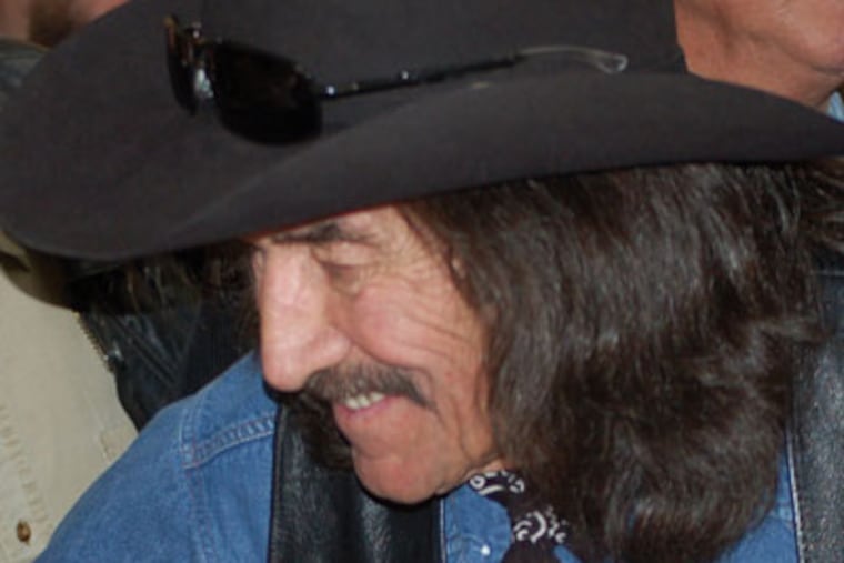 FILE -- In this Feb. 2, 2012 photo, Chicano Movement leader Reies Lopez Tijerina, left, is greeted by rancher Juan Valdez, 74, of Canjilon, NM, right, after an event honoring the 164th anniversary of the signing of the Treaty of Guadalupe Hidalgo at the New Mexico Statehouse in Santa Fe, N.M. Valdez, a land grant activist who fired the first shot during a 1967 New Mexico courthouse raid that grabbed international attention and helped spark the Chicano Movement, died Aug. 25, 2012. His daughter Juanita Montoya says the 74-year-old died peacefully Saturday at his ranch in Canjilon, N.M. (AP Photo/ Russell Contreras, file)